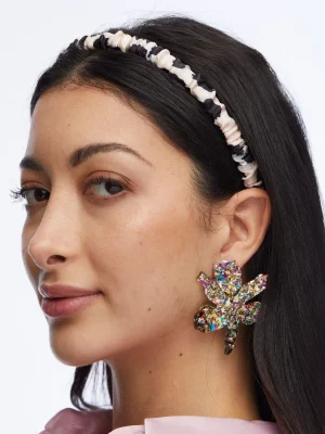 Model wearing House of 29 x Lele Sadoughi Rainbow Confetti Small Paper Lily Earrings – vibrant multicolor confetti floral earrings styled as a statement accessory, lightweight yet eye-catching design that adds playful color to any outfit, chic fashion jewelry trend 2025 for summer parties, weddings, or everyday glam.